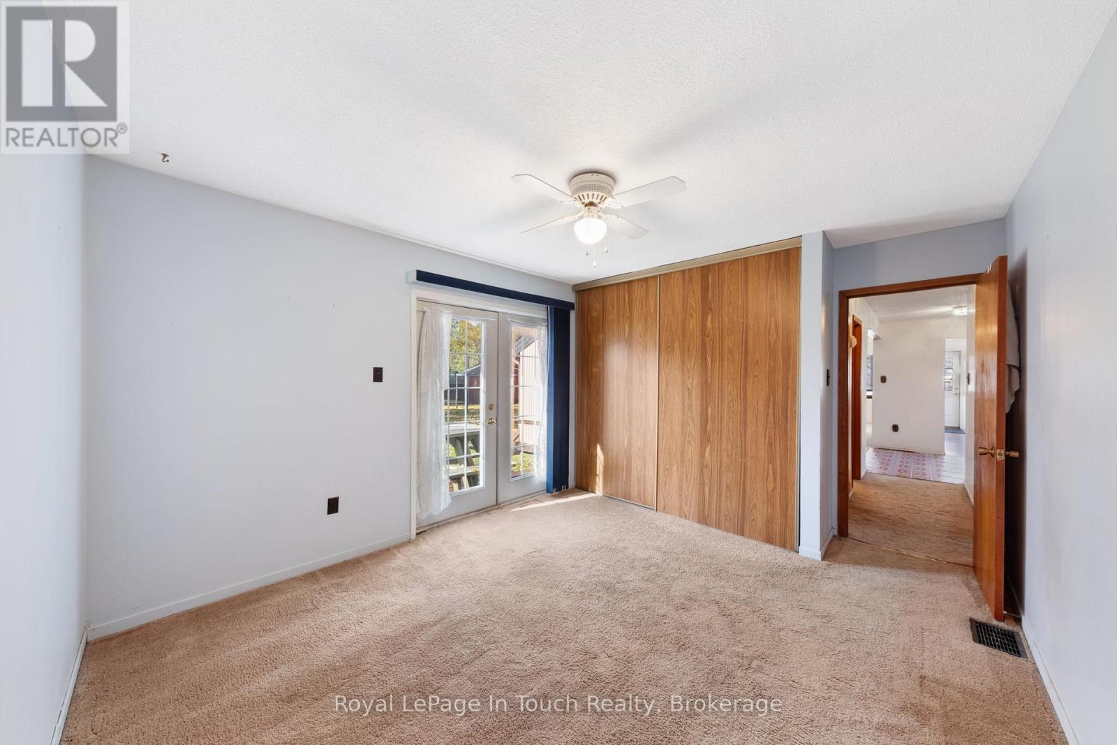 Primary Bedroom - 2 Coppercliff Crescent, Tiny, ON - Indoor Photo Showing Other Room