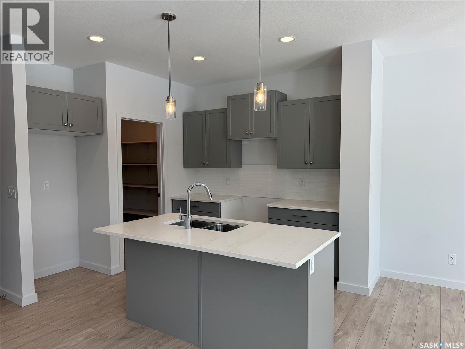 919 Traeger Manor, Saskatoon, SK - Indoor Photo Showing Kitchen With Double Sink With Upgraded Kitchen