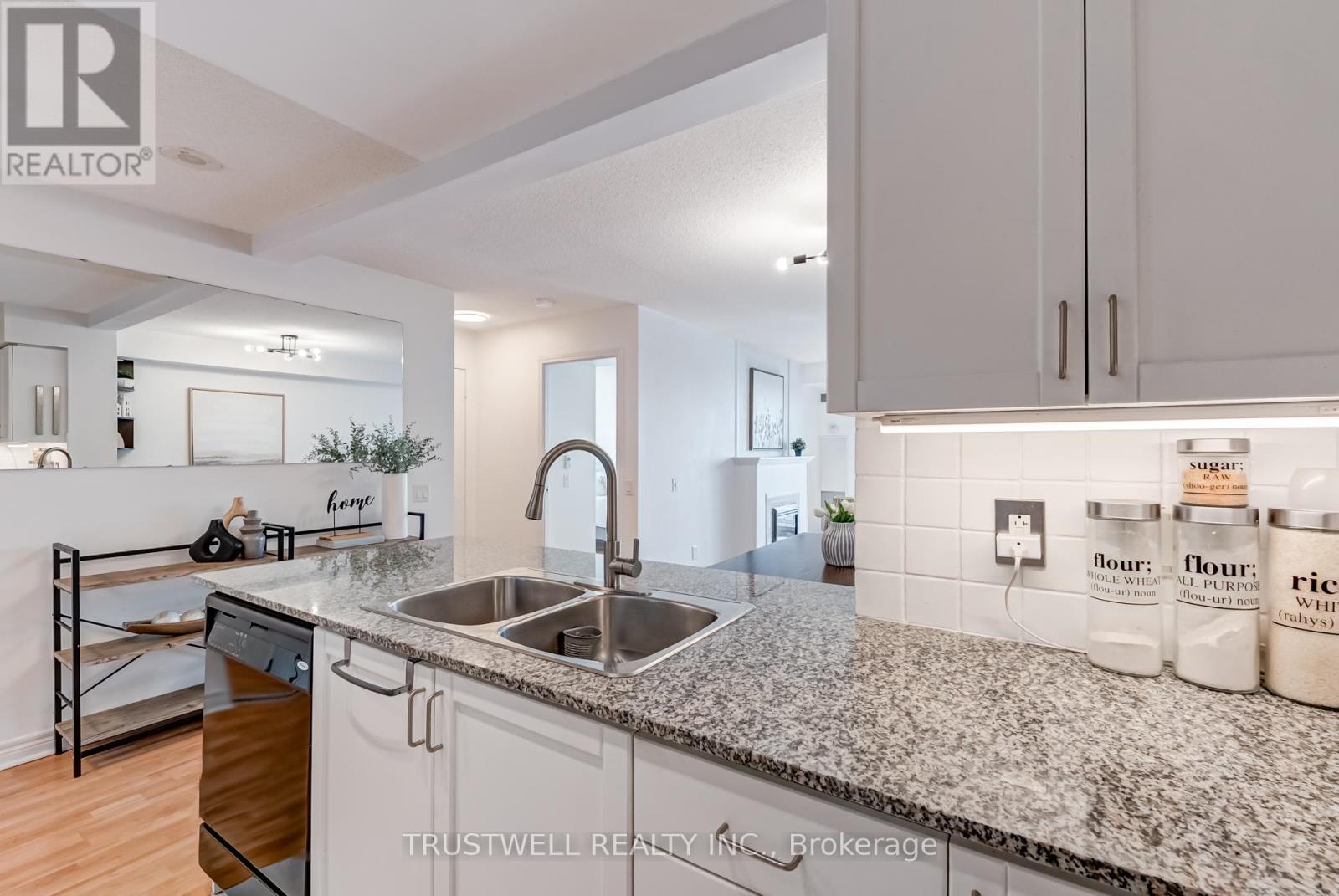 Kitchen Overlooks Living/Dining Areas - 2007 - 83 Borough Drive, Toronto, ON - Indoor Photo Showing Kitchen With Double Sink With Upgraded Kitchen