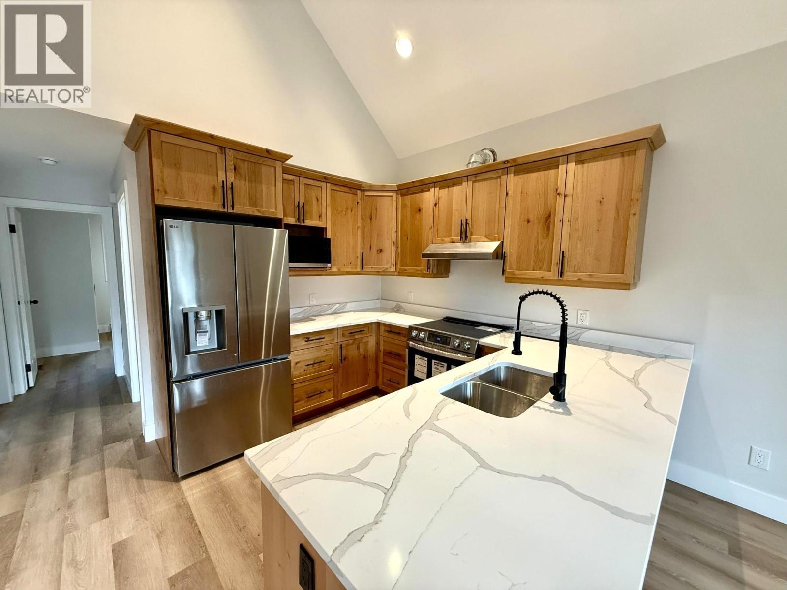 1938 Foxwood Trail Unit# 2, Windermere, BC - Indoor Photo Showing Kitchen With Stainless Steel Kitchen With Double Sink