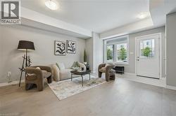 Living room with light wood-style flooring -