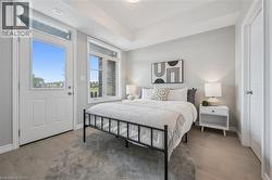 Bedroom with access to outside and light wood-type flooring -