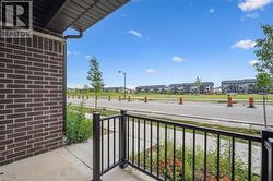 Covered porch featuring a residential view -