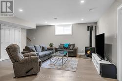 Basement rec room with gas fireplace -