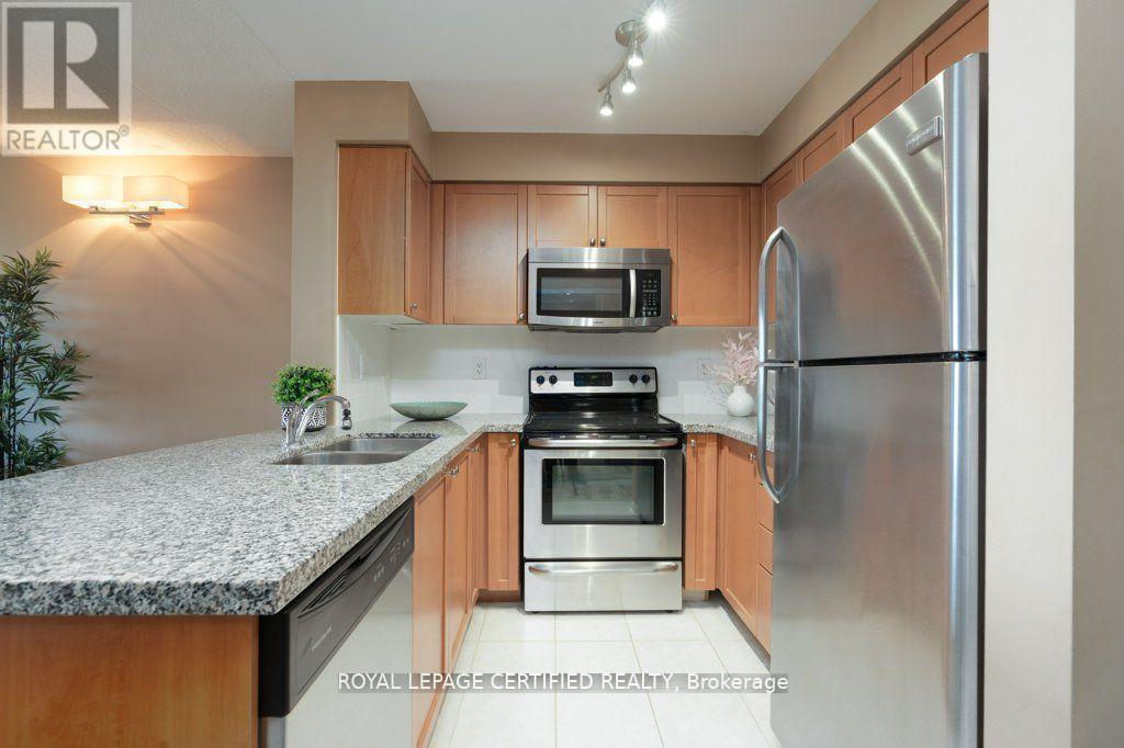 317 - 65 Via Rosedale, Brampton, ON - Indoor Photo Showing Kitchen With Double Sink