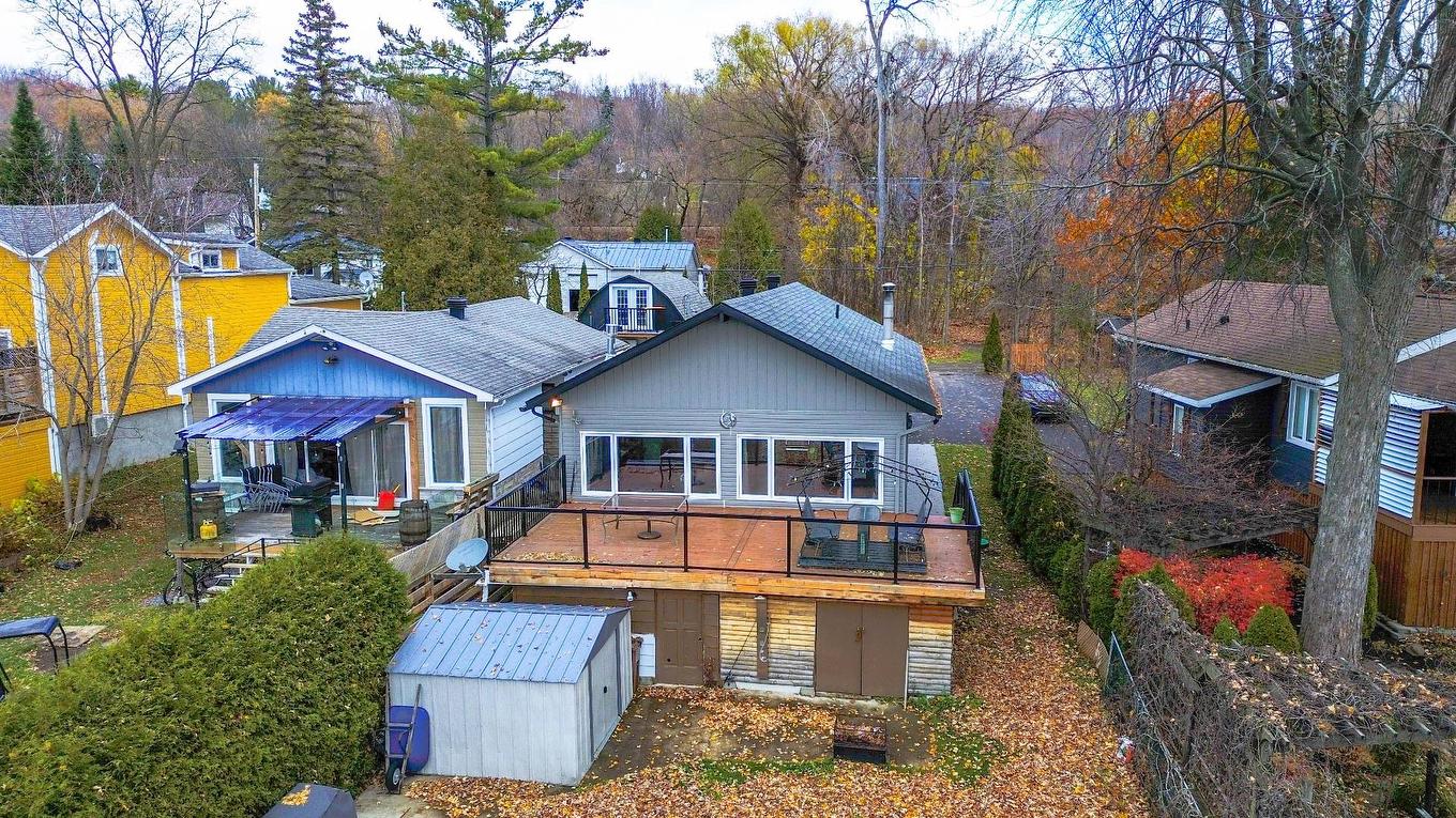 Back facade - 30 Rue Paquette, Grenville-Sur-La-Rouge, QC - Outdoor With Deck Patio Veranda