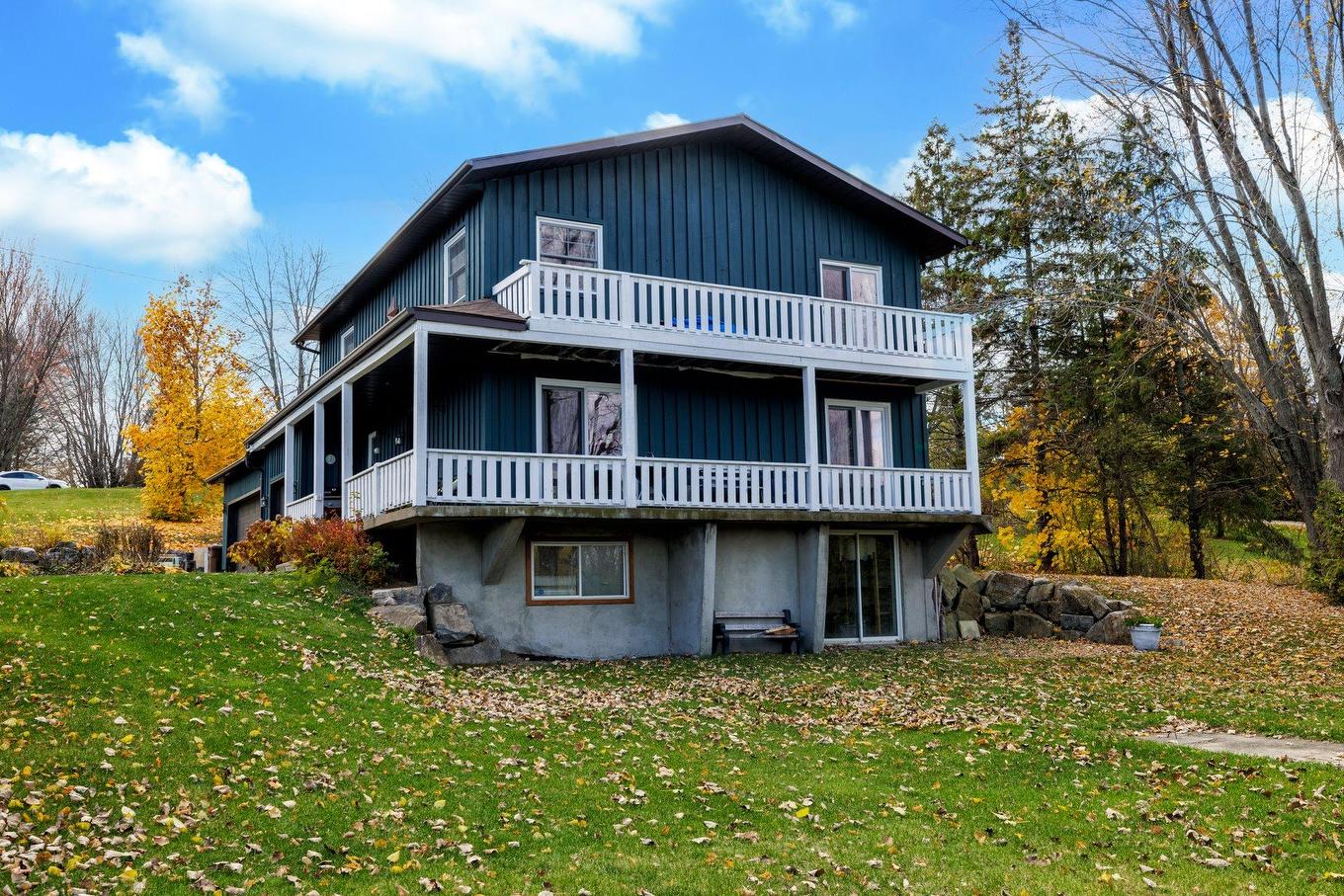 Frontage - 19 Rue Céline N., Rigaud, QC - Outdoor With Balcony With Deck Patio Veranda