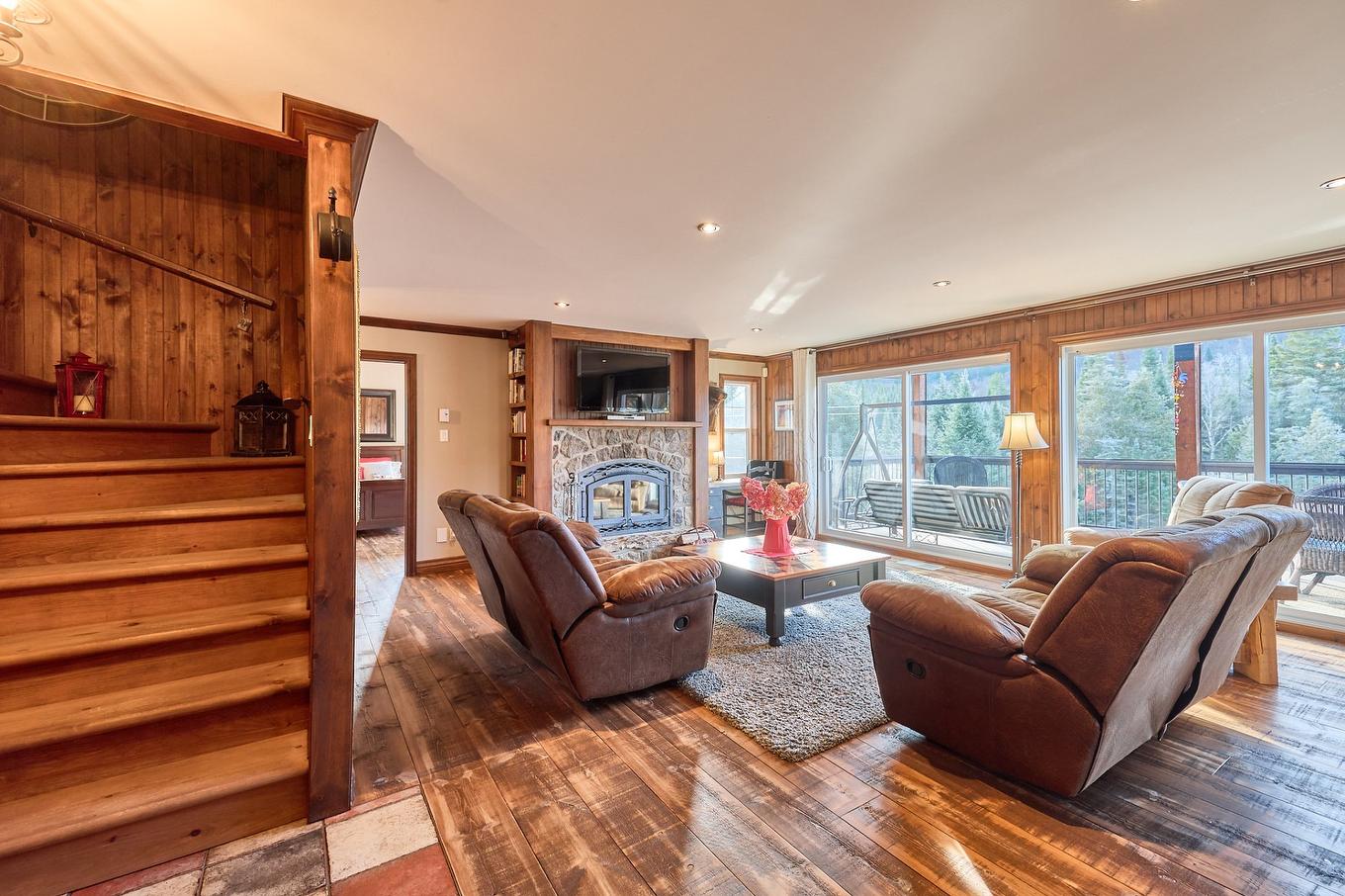 Living room - 6265 Ch. Des Hauteurs, Sainte-Adèle, QC - Indoor Photo Showing Living Room With Fireplace