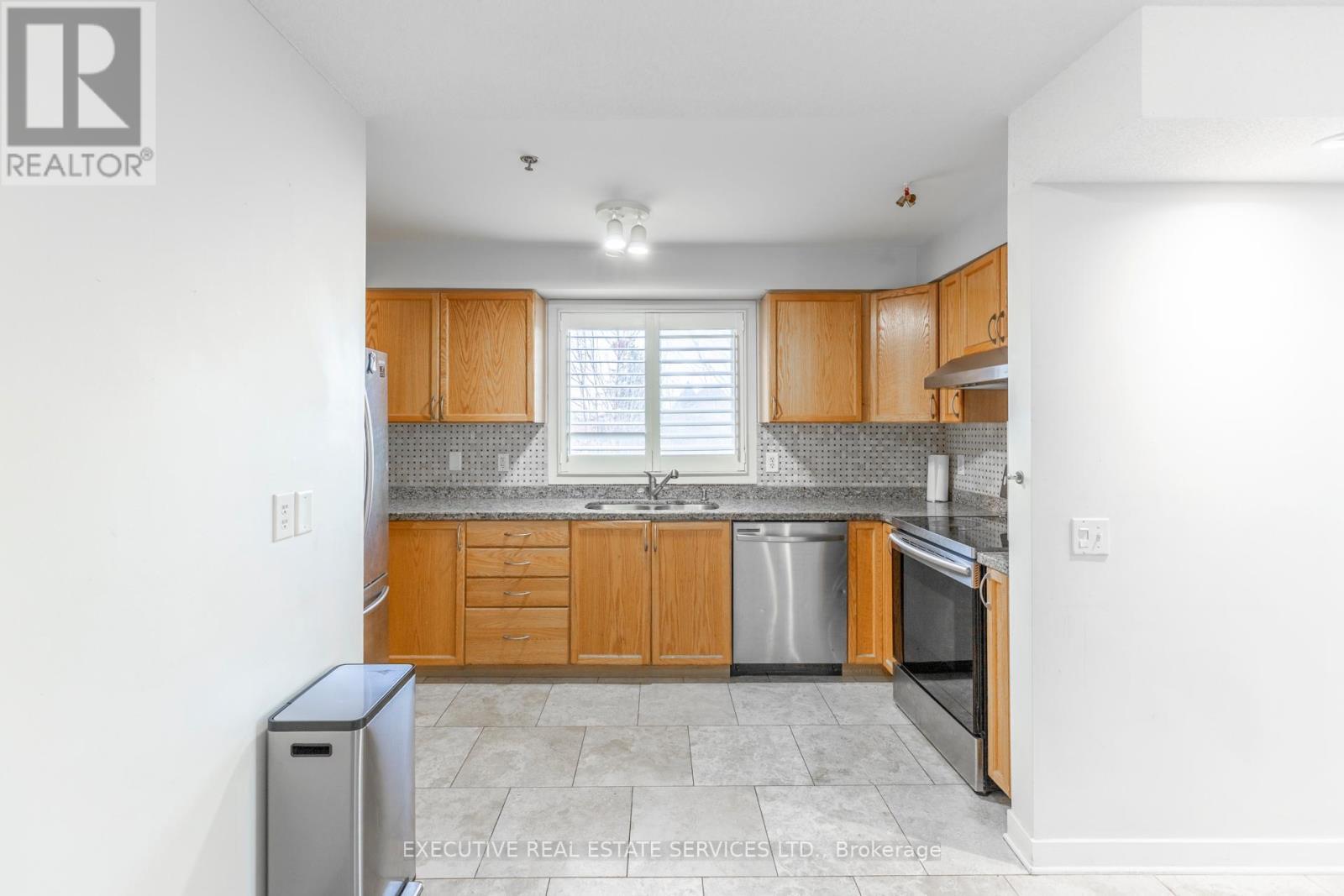 #203 - 4 Dayspring Circle, Brampton, ON - Indoor Photo Showing Kitchen With Double Sink