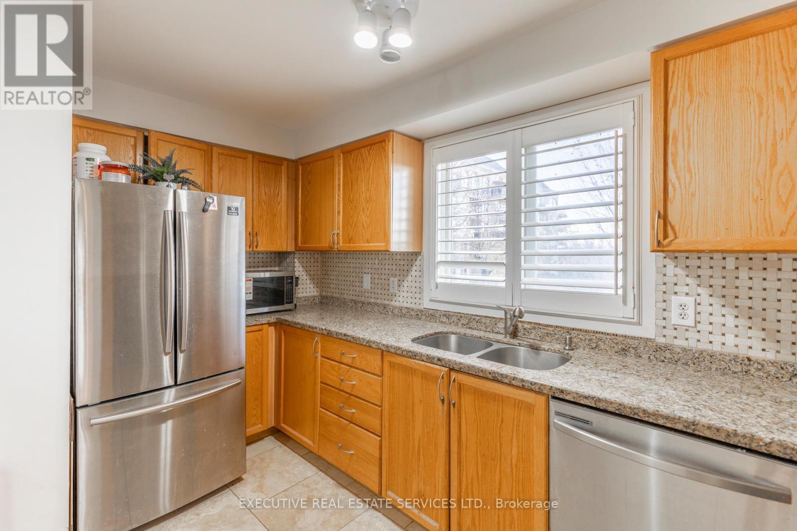 #203 - 4 Dayspring Circle, Brampton, ON - Indoor Photo Showing Kitchen With Stainless Steel Kitchen With Double Sink
