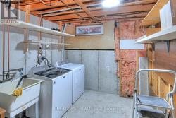 Laundry Room with New Dryer and Newer Washing Mach -