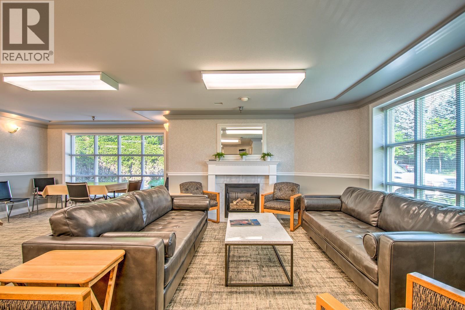 3220 Centennial Drive Unit# 109, Vernon, BC - Indoor Photo Showing Living Room With Fireplace