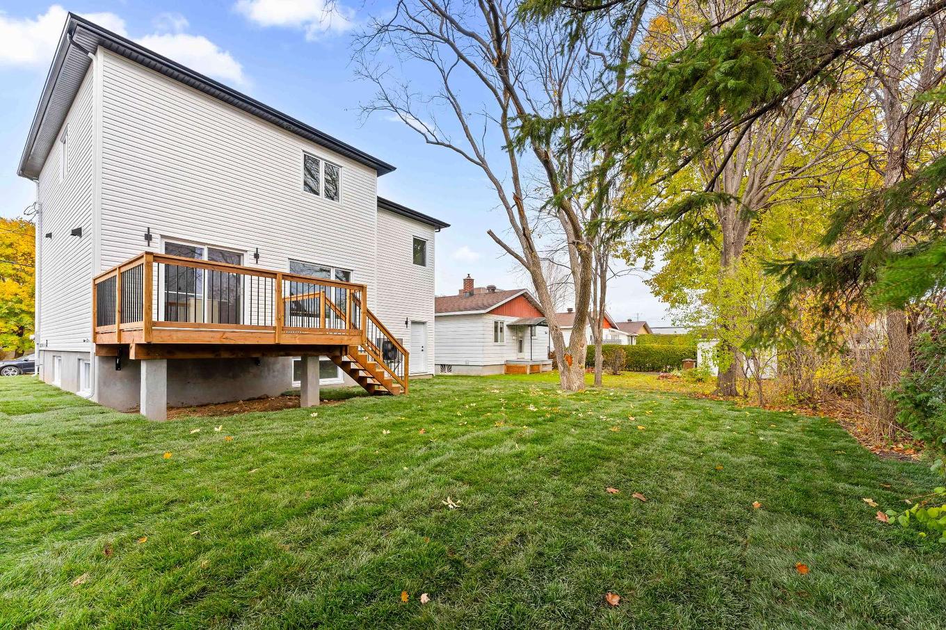 Back facade - 7 Rue Lavigne, Boisbriand, QC - Outdoor With Deck Patio Veranda With Exterior