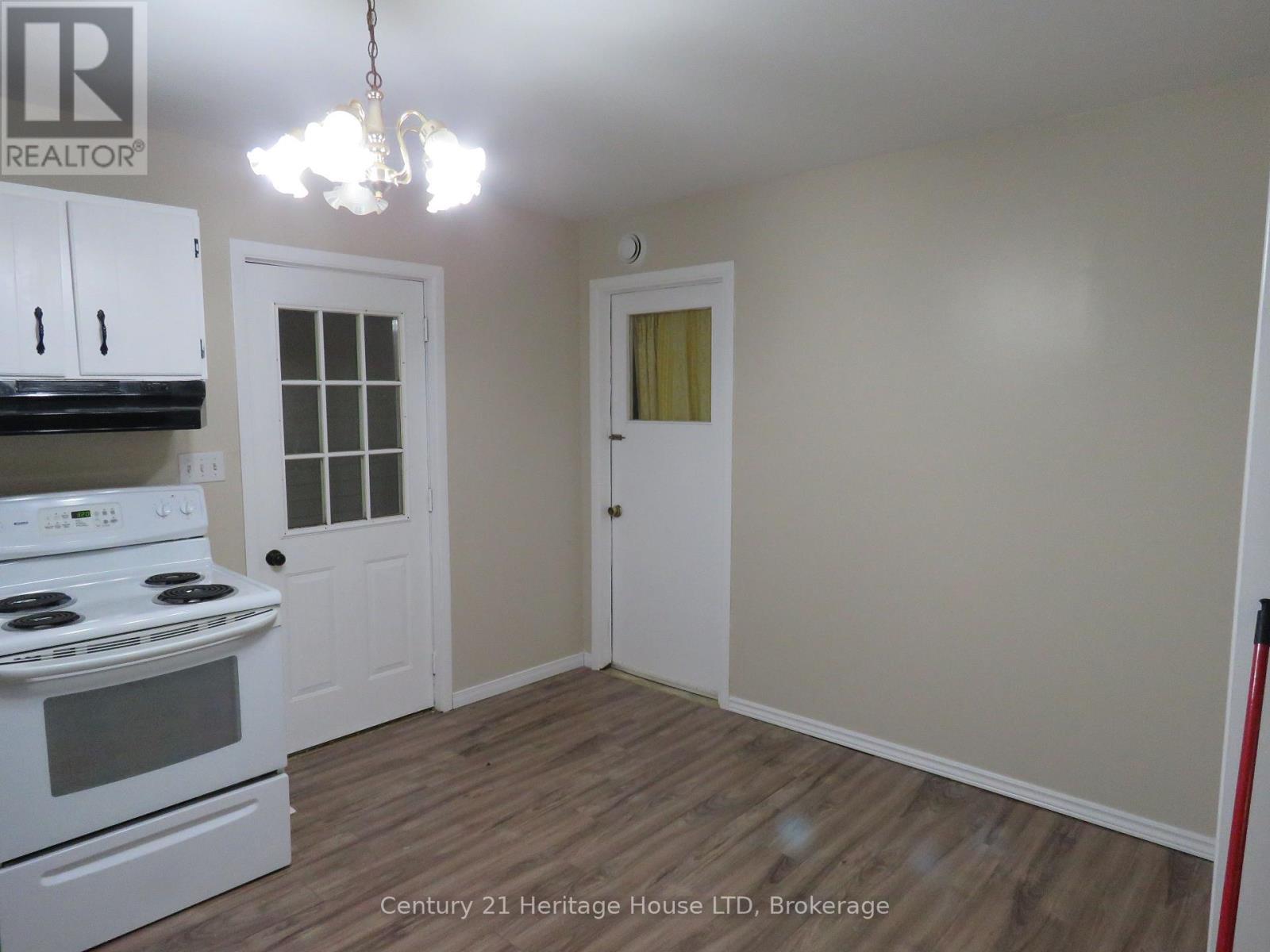 Door on right to shared laundry room - B - 564 Lakeview Road, Fort Erie (Crescent Park), ON - Indoor Photo Showing Kitchen