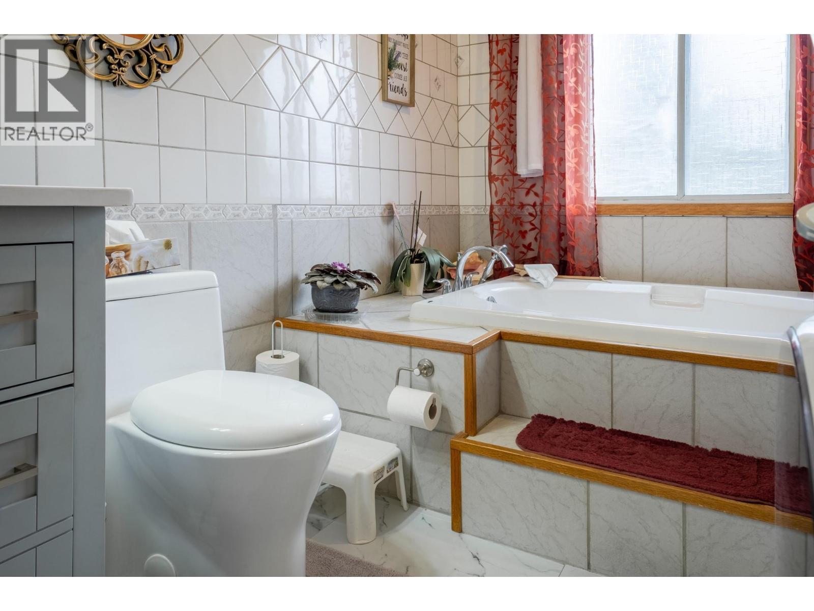 Main Bathroom and Laundry Room - 1801 Mission Road, Vernon, BC - Indoor Photo Showing Bathroom
