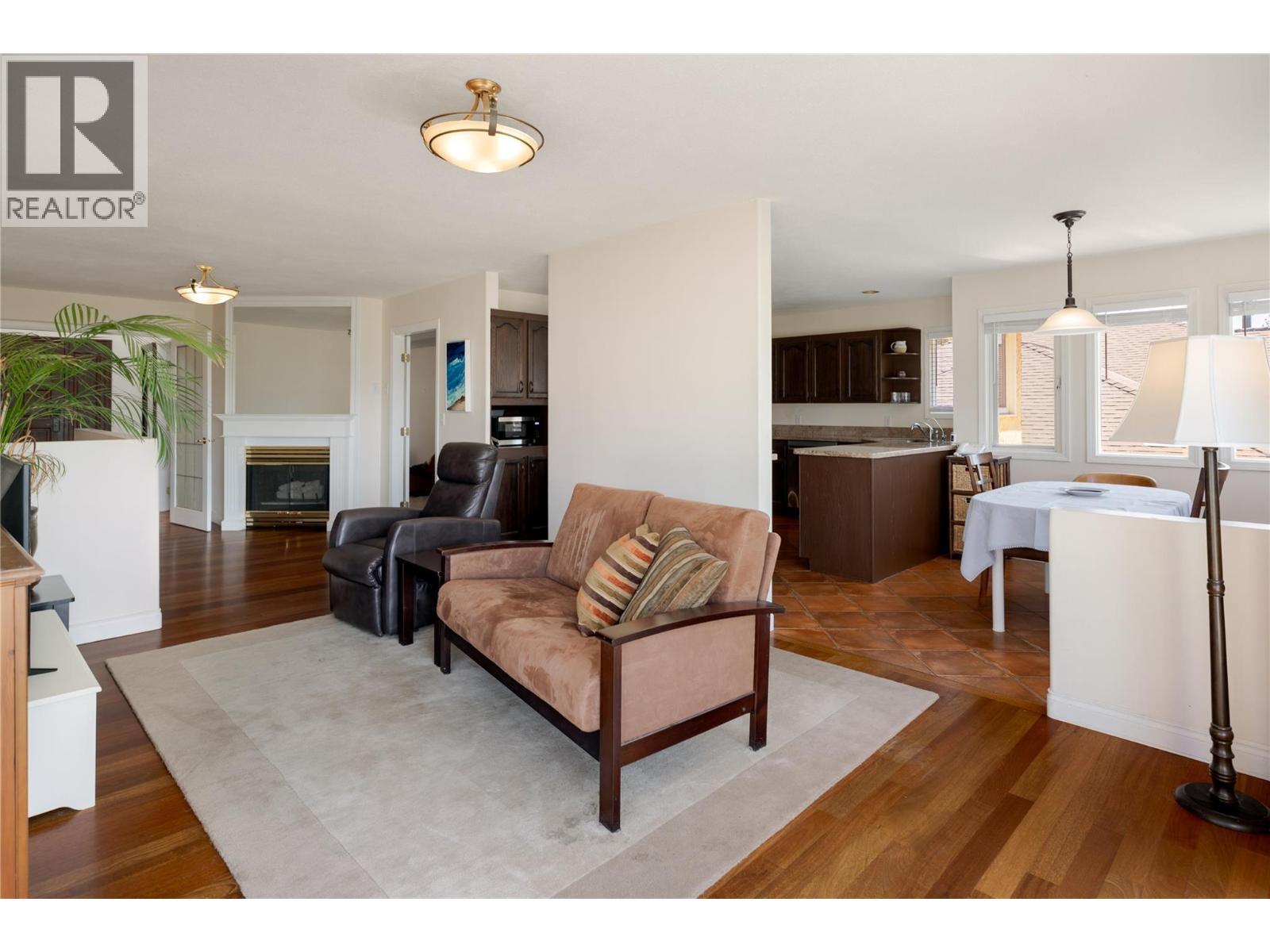 740 Royal Pine Drive, Kelowna, BC - Indoor Photo Showing Living Room With Fireplace