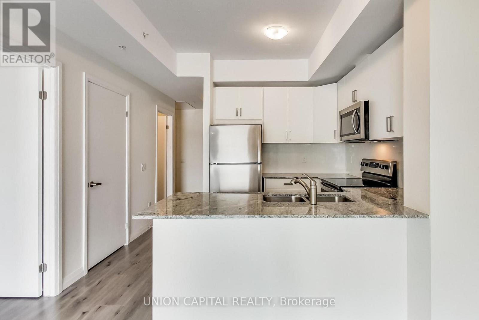801 - 60 Charles Street W, Kitchener, ON - Indoor Photo Showing Kitchen With Double Sink