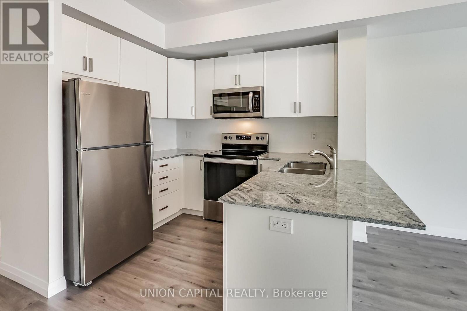 801 - 60 Charles Street W, Kitchener, ON - Indoor Photo Showing Kitchen With Double Sink