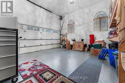 Garage with shelving and epoxy floor -