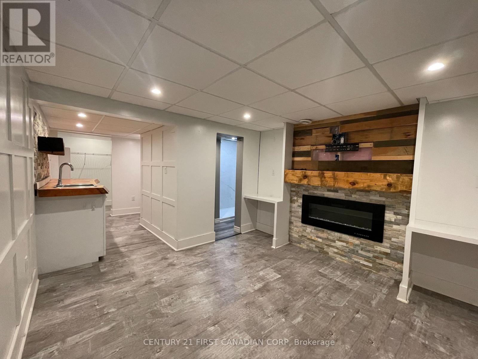 64 Edward Street, St. Thomas, ON - Indoor Photo Showing Other Room With Fireplace