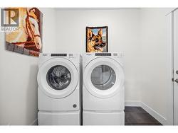 Laundry room between kitchen and garage -