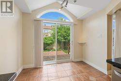 Patio doors in eat-in area lead to large rear deck -