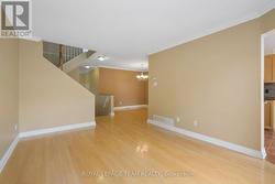 Spacious Living Rm with hardwood flooring. -
