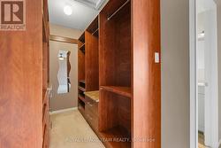 Custom cabinets in walk-in closet in Primary BR. -