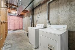 Laundry in lower level w/lots of space. -