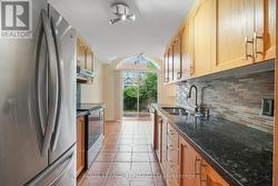 Eat-in Kitchen with granite countertops. -