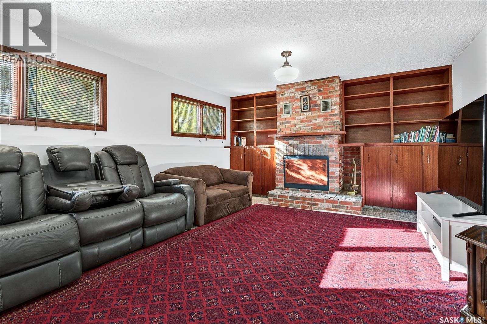 79 Bluebell Crescent, Moose Jaw, SK - Indoor Photo Showing Living Room With Fireplace