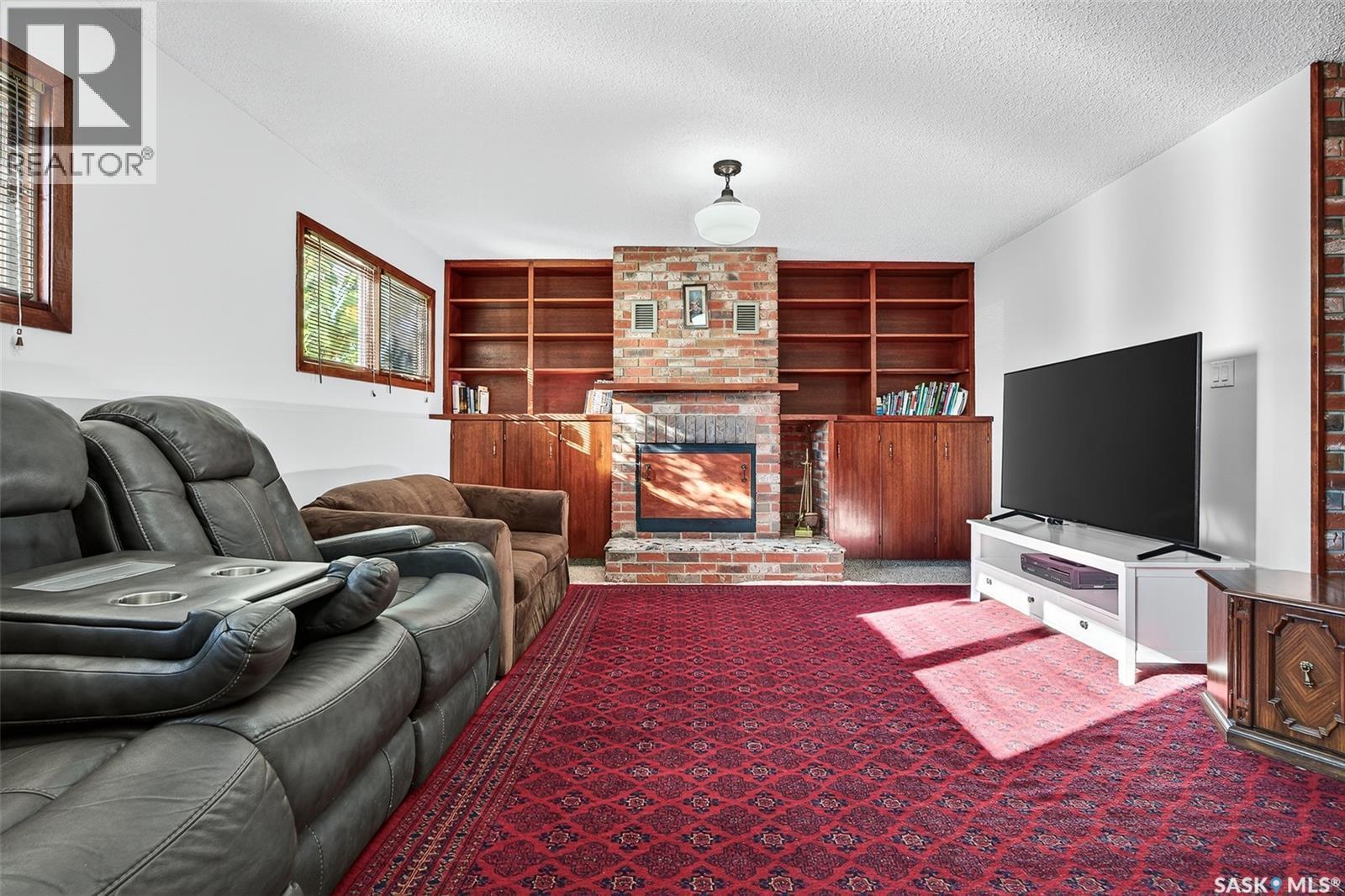 79 Bluebell Crescent, Moose Jaw, SK - Indoor Photo Showing Other Room With Fireplace