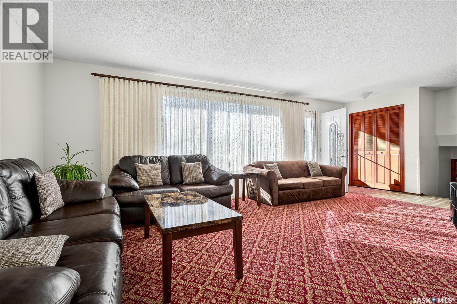 79 Bluebell Crescent, Moose Jaw, SK - Indoor Photo Showing Living Room With Fireplace