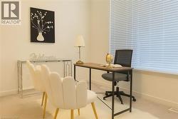 Carpeted office space with baseboards -