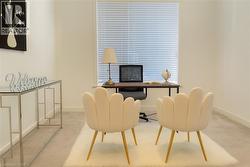 Office with carpet flooring and baseboards -