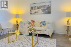 Living room with baseboards and wood finished floors -