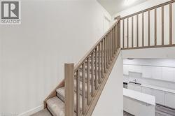 Staircase featuring baseboards -
