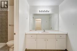 Full bathroom with vanity and light tile patterned floors -