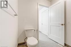 Bathroom featuring baseboards and light tile patterned floors -