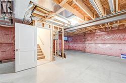 Unfinished basement with stairway -