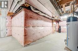 Unfinished basement with water heater -
