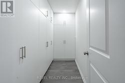 Primary Bedroom Walk In Closet -