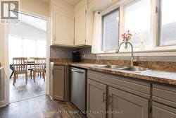 The kitchen leads to the formal dining room. -