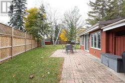 Backyard is almost completely fenced in. -