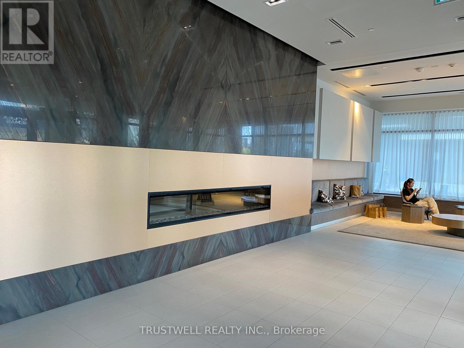 906 - 128 Fairview Mall Drive, Toronto, ON - Indoor Photo Showing Other Room With Fireplace