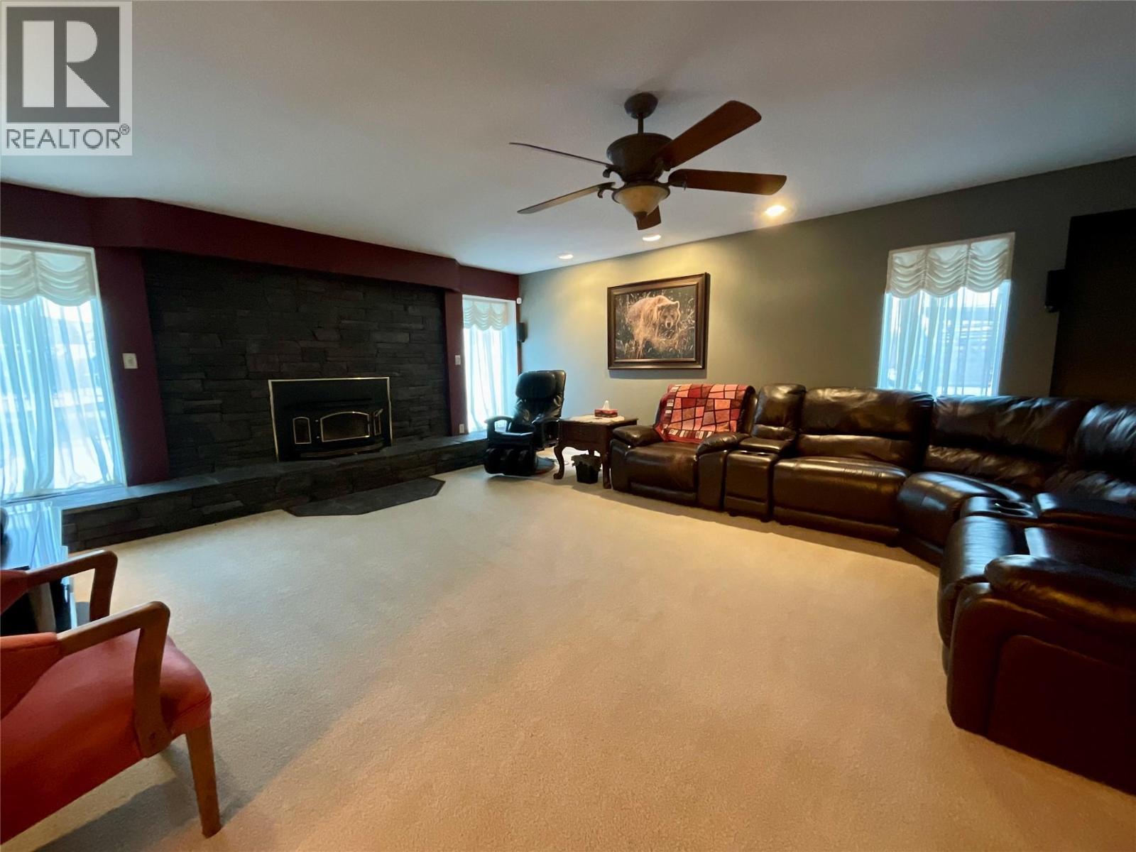 12 Collier Place, Tumbler Ridge, BC - Indoor Photo Showing Living Room With Fireplace