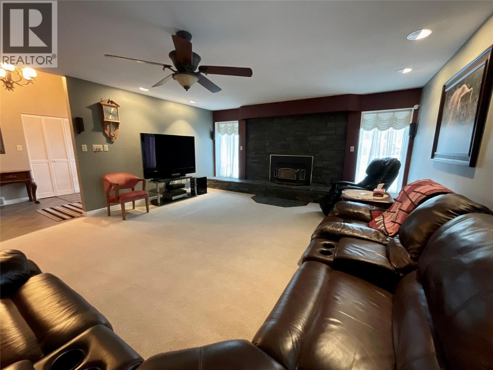 12 Collier Place, Tumbler Ridge, BC - Indoor Photo Showing Living Room With Fireplace