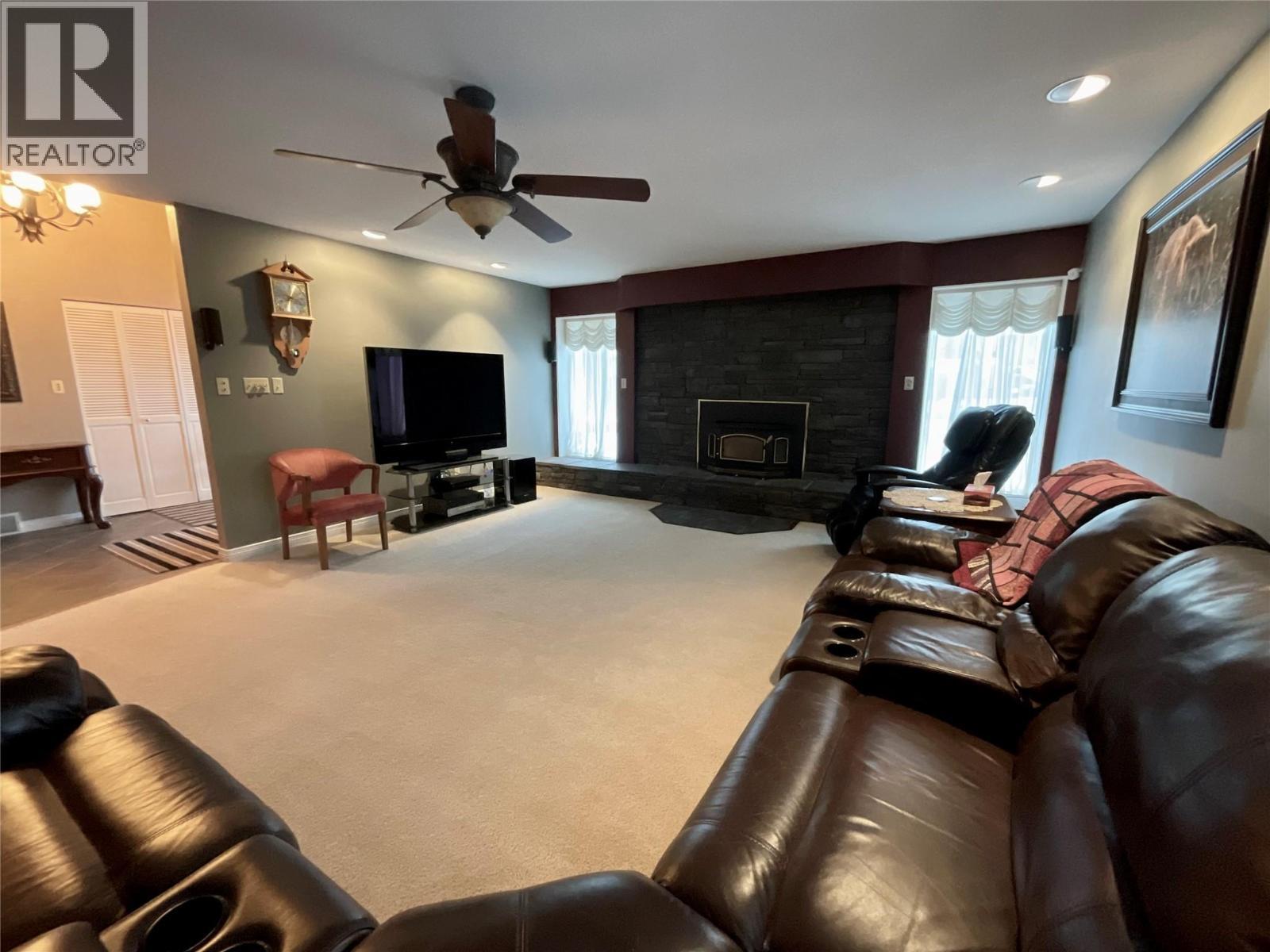 12 Collier Place, Tumbler Ridge, BC - Indoor Photo Showing Living Room With Fireplace