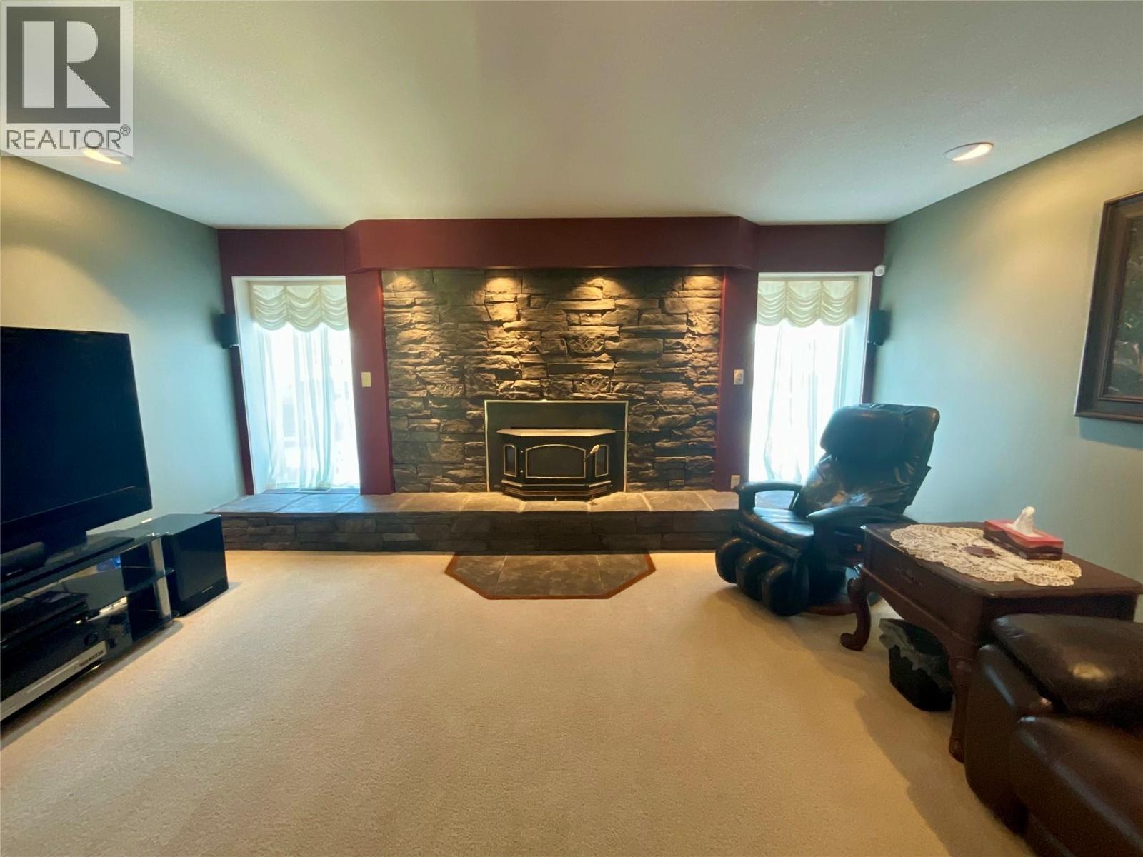 12 Collier Place, Tumbler Ridge, BC - Indoor Photo Showing Other Room With Fireplace