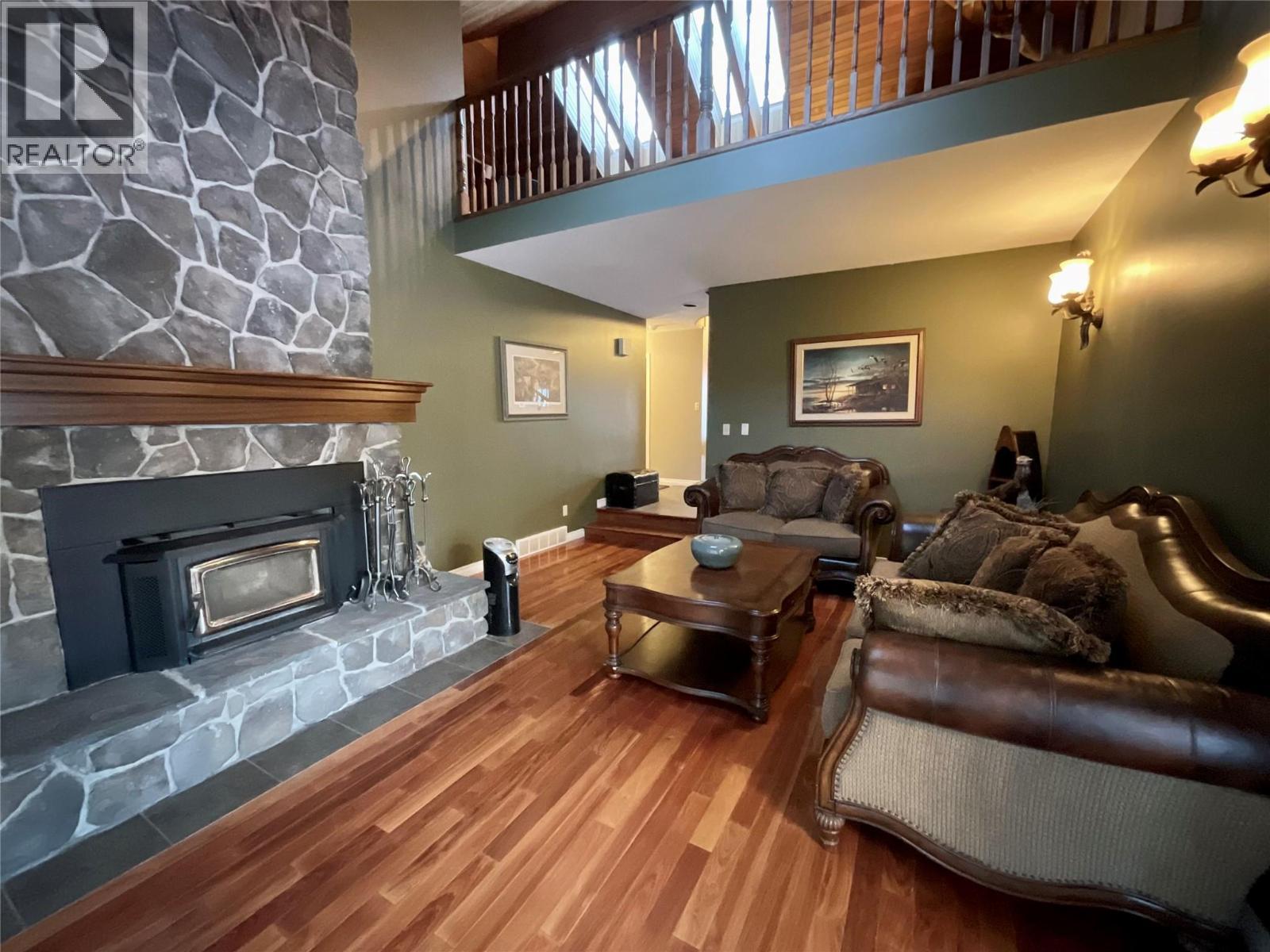 12 Collier Place, Tumbler Ridge, BC - Indoor Photo Showing Living Room With Fireplace